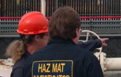 Image of two people at a hazmat incident
